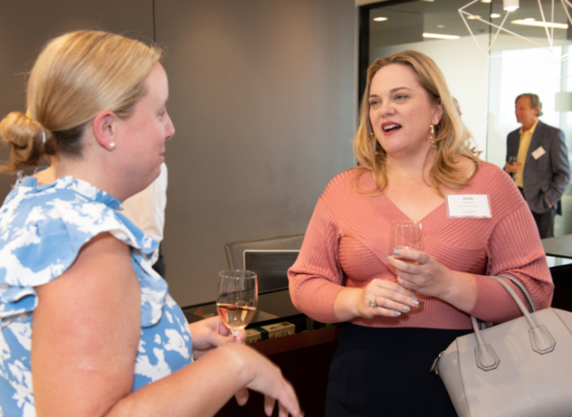 people talking at boyarmiller open house